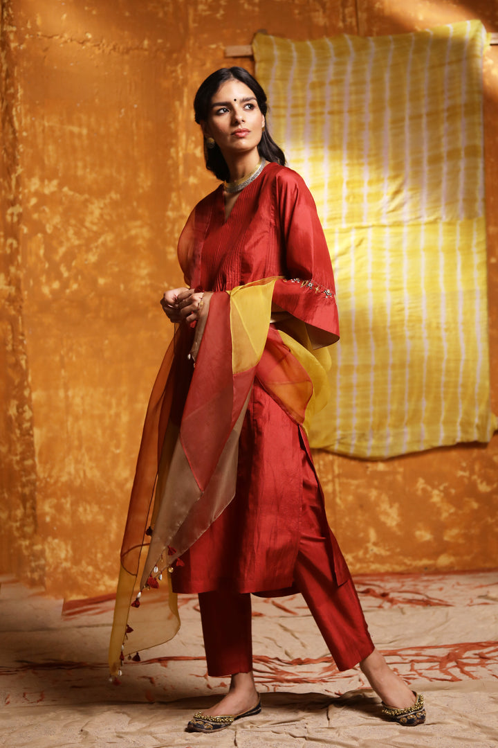 Maroon silk straight pants.