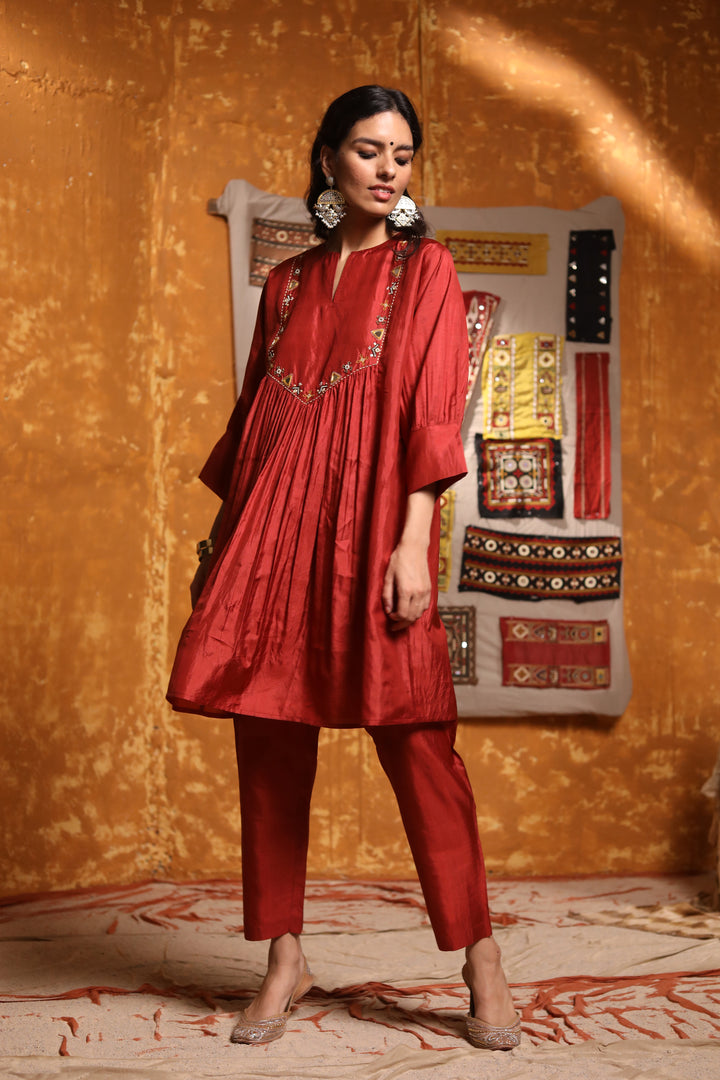 Maroon silk straight pants.