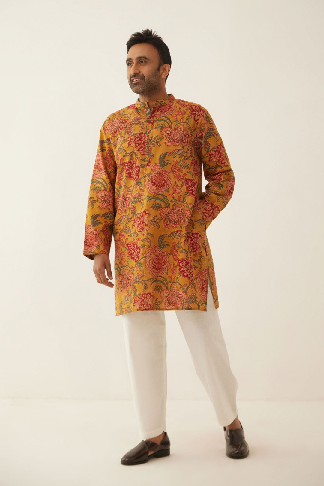 BURNT ORANGE FLORAL CHINTZ MEN SHORT KURTA WITH WHITE COTTON PANTS   SHIVANI BHARGAVA