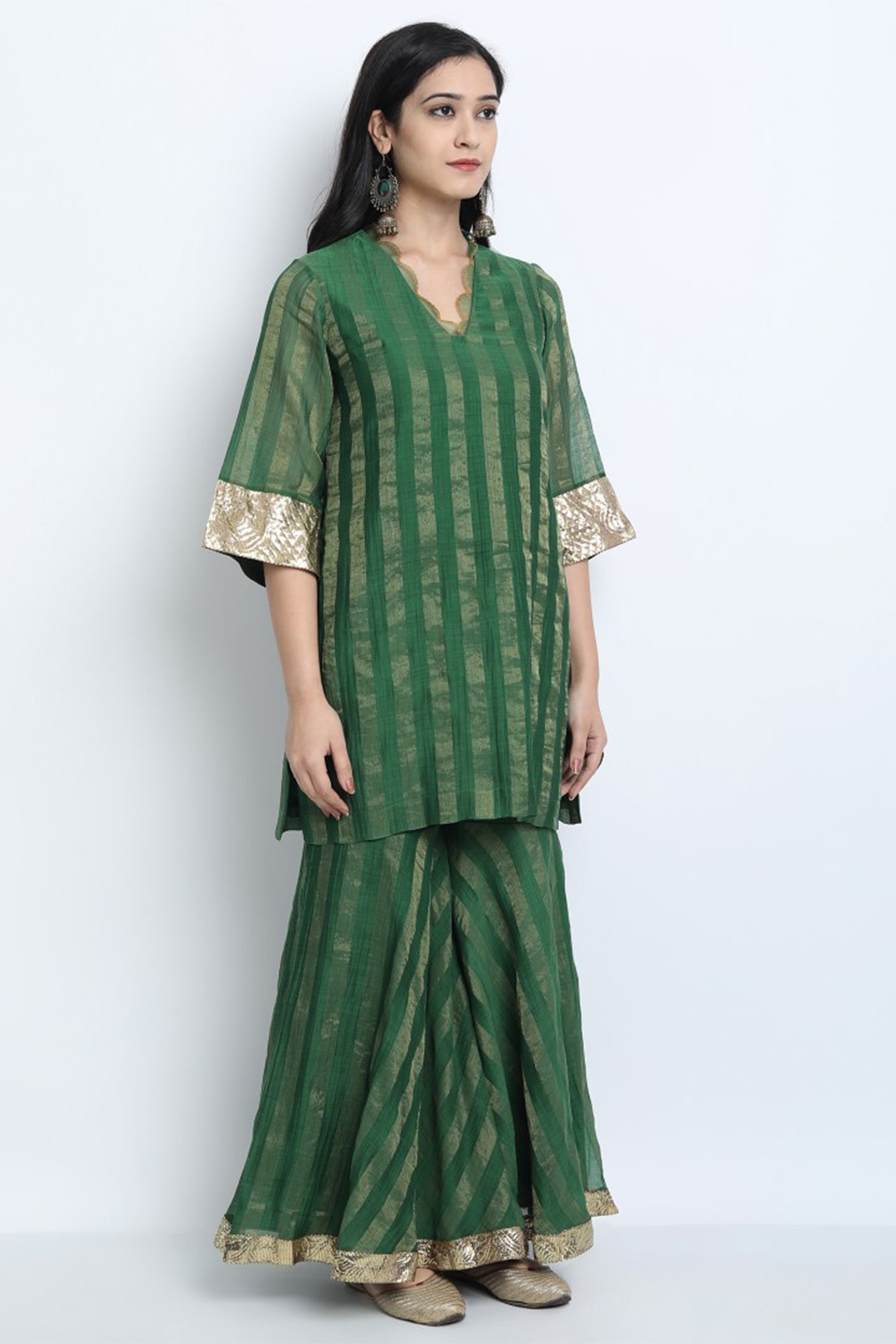 EMERALD GREEN ZARI STRIPE CHANDERI MEERA GHARARA WITH SHORT KURTA AND DUPATTA.